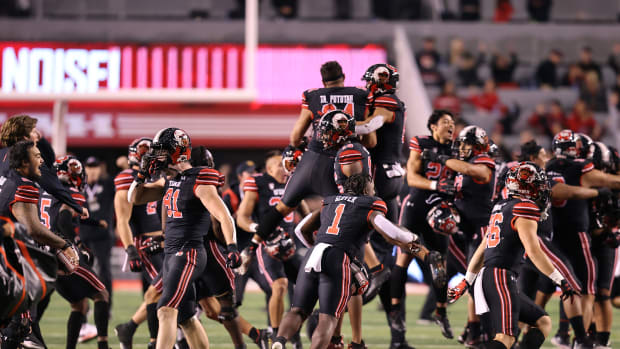 Utah Utes players celebrate their last minute win over the USC Trojans at Rice-Eccles Stadium.