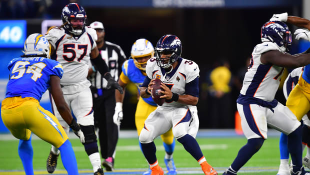 Denver Broncos quarterback Russell Wilson (3) runs the ball against the Los Angeles Chargers during the second half at SoFi Stadium.