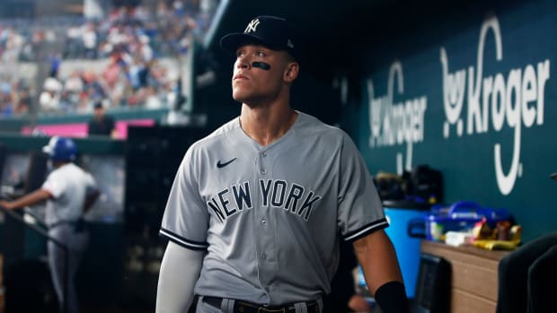 Yankees star Aaron Judge walks in the dugout. (2022)