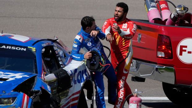 Bubba Wallace pushes Kyle Larson after the two crashed in Las Vegas.