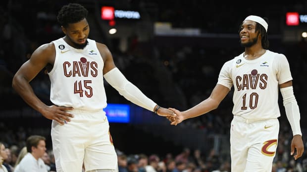 Cleveland Cavaliers guard Donovan Mitchell (45) and guard Darius Garland (10) shake hands after a play during the second half against the Atlanta Hawks.