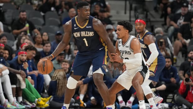 Oct 9, 2022; San Antonio, Texas, USA; New Orleans Pelicans forward Zion Williamson (1) dribbles in front of San Antonio Spurs guard Tre Jones (33) in the second half at the AT&T Center.