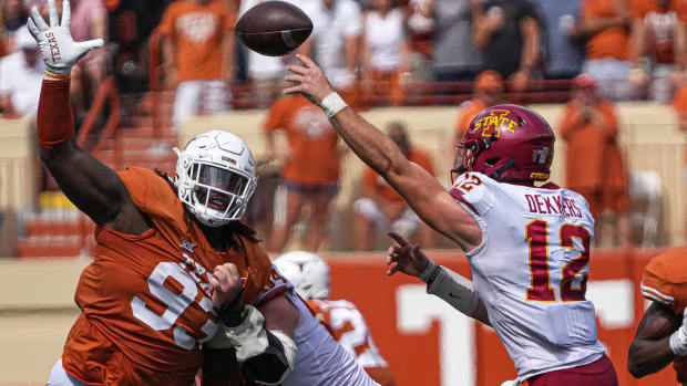 Texas Longhorns T'Vondre Sweat (93) tries to swat a pass by Iowa State quarterback Hunter Dekkers (12) during the game at Royal Memorial Stadium in Austin, Texas on Oct. 15, 2022. Aem Texas Vs Iowa State 30