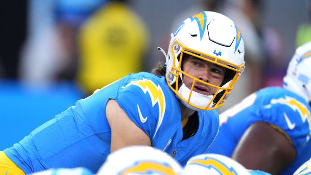 Oct 17, 2022; Inglewood, California, USA; Los Angeles Chargers quarterback Justin Herbert (10) takes the snap in the first half against the Denver Broncos at SoFi Stadium. Mandatory Credit: Kirby Lee-USA TODAY Sports