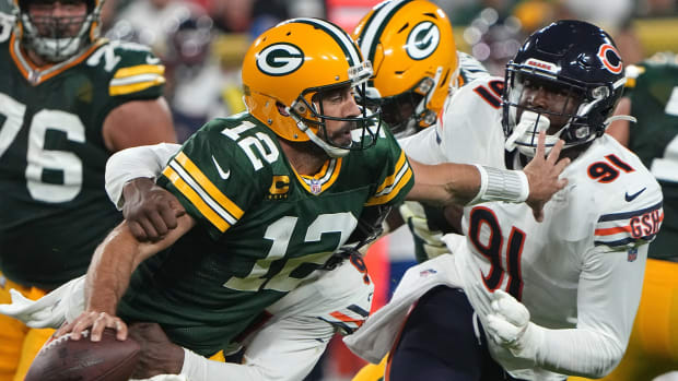 Green Bay Packers quarterback Aaron Rodgers (12) is sacked by Chicago Bears linebacker Robert Quinn. Nfl Chicago Bears At Green Bay Packers