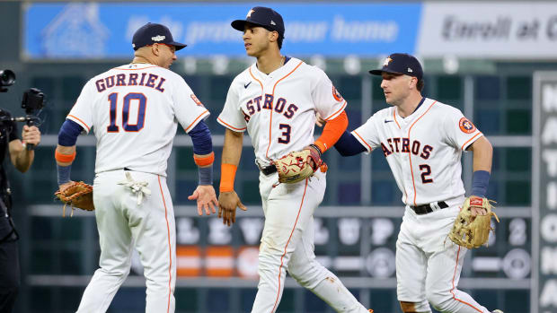 Oct 19, 2022; Houston, Texas, USA; Houston Astros first baseman Yuli Gurriel (10) and shortstop Jeremy Pena (3) and third baseman Alex Bregman (2) celebrate after their win against the New York Yankees in game one of the ALCS for the 2022 MLB Playoffs at Minute Maid Park.