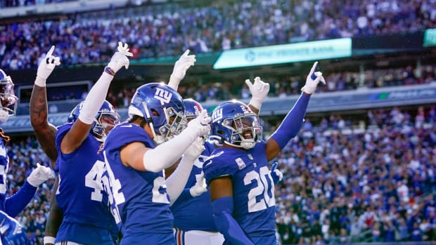 New York Giants safety Julian Love (20) and the defense celebrate an interception in the second half. The Giants defeat the Ravens, 24-20, at MetLife Stadium on Sunday, Oct. 16, 2022.