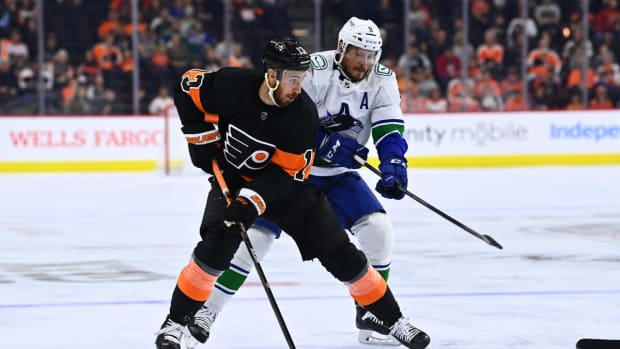 Oct 15, 2022; Philadelphia, Pennsylvania, USA; Philadelphia Flyers center Kevin Hayes (13) controls the puck ahead of Vancouver Canucks center J.T. Miller (9) in the first period at Wells Fargo Center. Mandatory Credit: Kyle Ross-USA TODAY Sports