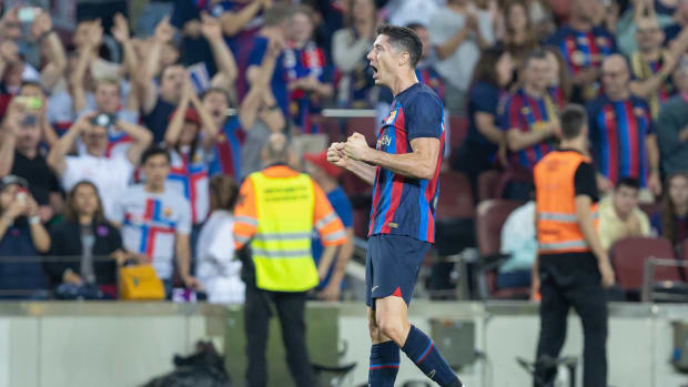 Robert Lewandowski pictured celebrating after scoring a goal for Barcelona against Villarreal in October 2022