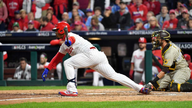 Oct 21, 2022; Philadelphia, Pennsylvania, USA; Philadelphia Phillies second baseman Jean Segura (2) hits a 2-RBI single in the fifth inning during game three of the NLCS against the San Diego Padres for the 2022 MLB Playoffs at Citizens Bank Park.