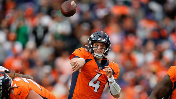 Denver Broncos quarterback Brett Rypien (4) attempts a pass in the fourth quarter against the New York Jets at Empower Field at Mile High.
