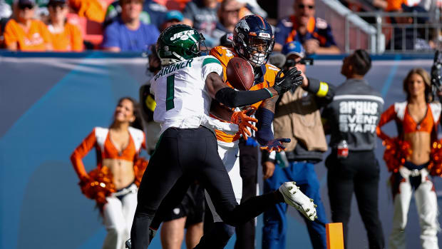 Oct 23, 2022; Denver, Colorado, USA; New York Jets cornerback Sauce Gardner (1) breaks up a pass intended for Denver Broncos wide receiver Courtland Sutton (14) in the second quarter at Empower Field at Mile High. Mandatory Credit: Isaiah J. Downing-USA TODAY Sports
