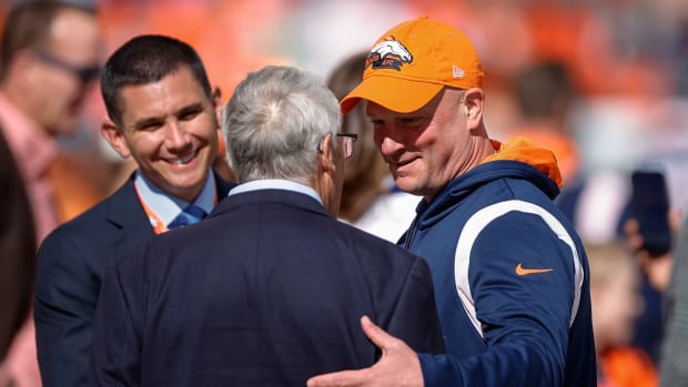 Denver Broncos head coach Nathaniel Hackett greets owner Rob Walton before the game against the New York Jets at Empower Field at Mile High.