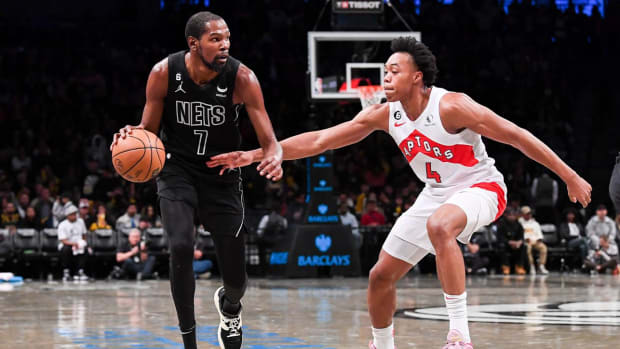 Oct 21, 2022; Brooklyn, New York, USA; Brooklyn Nets forward Kevin Durant (7) dribble with the ball defended by Toronto Raptors forward Scottie Barnes (4) during the third quarter at Barclays Center.
