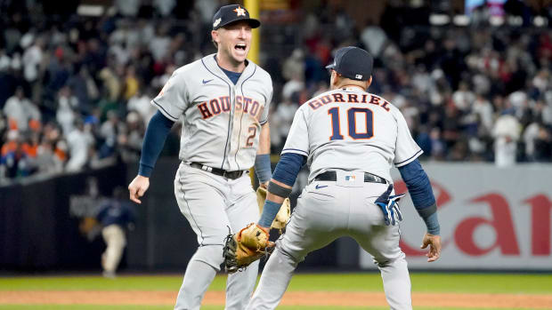 Astros third baseman Alex Bregman celebrates with first baseman Yuli Gurriel after beating the Yankees to clinch the AL pennant.