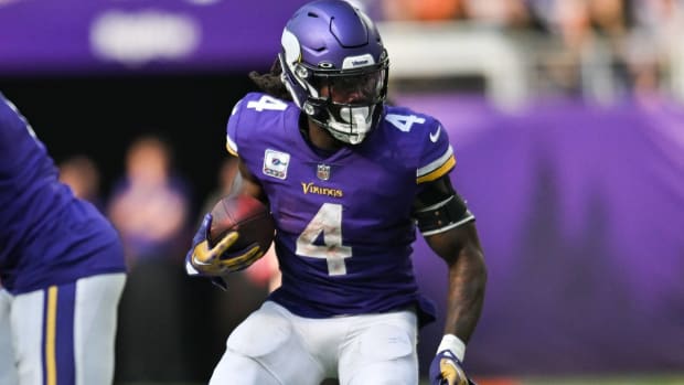Vikings running back Dalvin Cook runs with the ball in a game vs. the Chicago Bears.