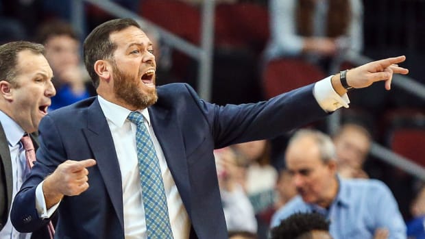Manhattan basketball coach Steve Masiello yells at the team on the sidelines during a game in 2017.