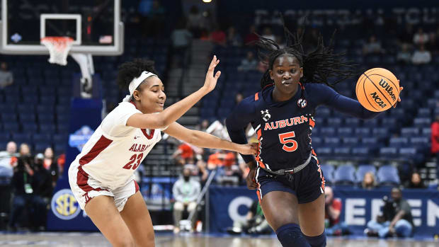 Auburn guard Aicha Coulibaly (5) tries to get by Alabama guard Brittany Davis (23) during the SEC Women's Basketball Tournament game in Nashville, Tenn. on Wednesday, March 2, 2022. Auburn Alabama Sec