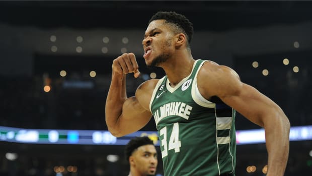 Oct 22, 2022; Milwaukee, Wisconsin, USA; Milwaukee Bucks forward Giannis Antetokounmpo (34) mean mugs to the audience after powering his way to the basket and being fouled by a Houston Rockets player in the first quarter at Fiserv Forum.