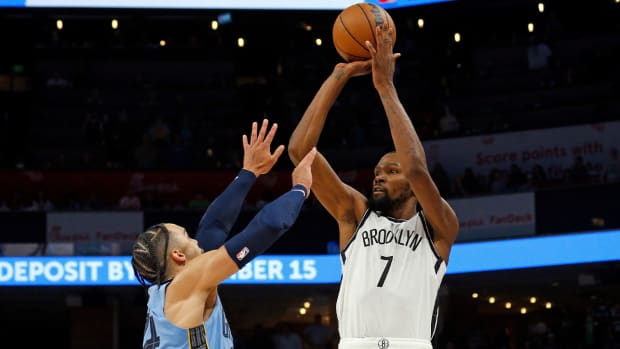 Oct 24, 2022; Memphis, Tennessee, USA; Brooklyn Nets forward Kevin Durant (7) shoots over Memphis Grizzlies forward Dillon Brooks (24) during the second half at FedExForum.