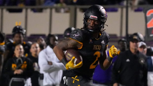 Oct 22, 2022; Greenville, North Carolina, USA; East Carolina Pirates running back Keaton Mitchell (2) runs for a touchdown against the UCF Knights during the second half at Dowdy-Ficklen Stadium. Mandatory Credit: James Guillory-USA TODAY Sports