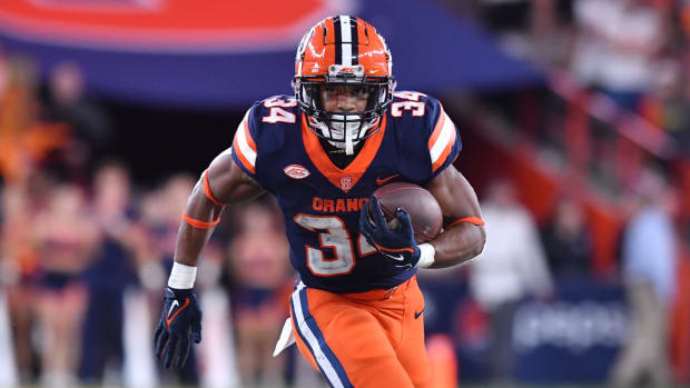 Oct 15, 2022; Syracuse, New York, USA; Syracuse Orange running back Sean Tucker (34) runs for a touchdown against the North Carolina State Wolfpack in the fourth quarter at JMA Wireless Dome.
