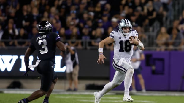 Oct 22, 2022; Fort Worth, Texas, USA; Kansas State Wildcats quarterback Will Howard (18) runs the ball against TCU Horned Frogs safety Mark Perry (3) in the second quarter at Amon G. Carter Stadium. Mandatory Credit: Tim Heitman-USA TODAY Sports