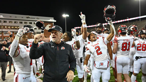 Utah Utes head coach Kyle Whittingham sings the school fight song with his team after a game against the Washington State Cougars at Gesa Field at Martin Stadium. Utah won 21-17.