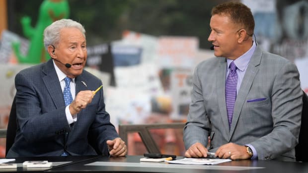 College Football analysts Lee Corso and Kirk Herbstreit sit next to each other during a College Gameday broadcast at the University of Tennessee campus.