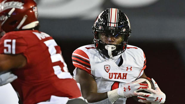 Utah Utes running back Jaylon Glover (1) carries the ball against the Washington State Cougars in the first half at Gesa Field at Martin Stadium.