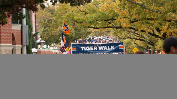 The Auburn fans gather for Tiger Walk before the Tigers and the Razorbacks clash.