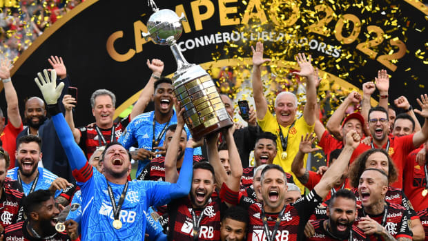 Players from Flamengo pictured celebrating with their trophy after winning the 2022 Copa Libertadores