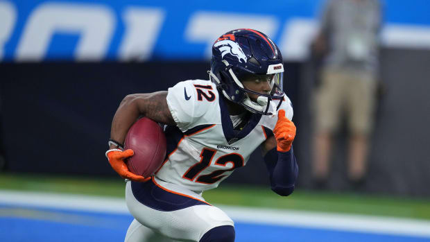 Denver Broncos wide receiver Montrell Washington (12) carries the ball on a kickoff return against the Los Angeles Chargers at SoFi Stadium. The Chargers defeated the Broncos 19-16 in overtime.