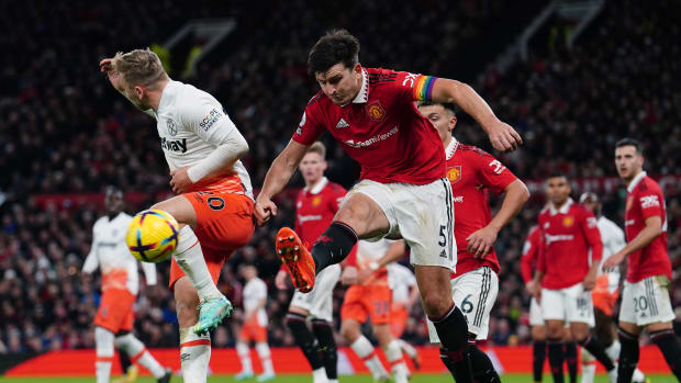 Manchester United captain Harry Maguire pictured (center) clearing the ball under pressure from Jarrod Bowen (left) during a 1-0 win over West Ham in October 2022