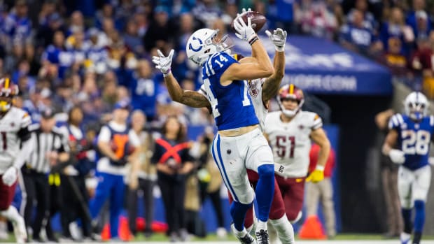 Oct 30, 2022; Indianapolis, Indiana, USA; Indianapolis Colts wide receiver Alec Pierce (14) catches the ball while Washington Commanders cornerback Benjamin St-Juste (25) defends in the second half at Lucas Oil Stadium.