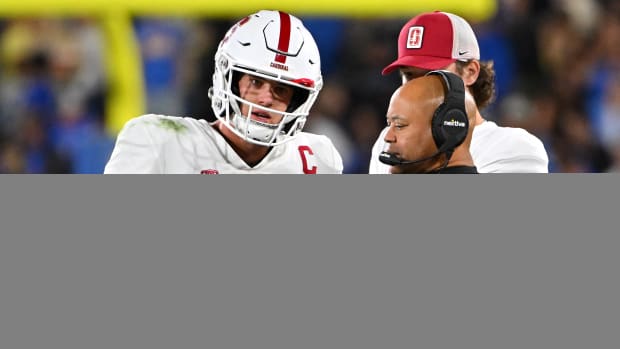 Stanford Cardinal head coach David Shaw talks with quarterback Tanner McKee (18) during a time out in the first half against the UCLA Bruins at the Rose Bowl.