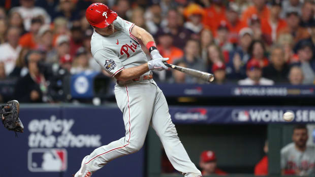 Oct 29, 2022; Houston, Texas, USA; Philadelphia Phillies catcher J.T. Realmuto (10) hits a single during the eighth inning against the Houston Astros in game two of the 2022 World Series at Minute Maid Park.