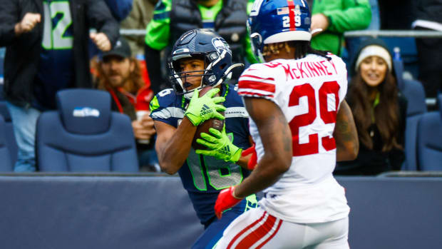 Oct 30, 2022; Seattle, Washington, USA; Seattle Seahawks wide receiver Tyler Lockett (16) catches a touchdown against the New York Giants during the fourth quarter at Lumen Field.