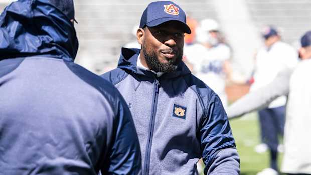 Auburn running backs coach Carnell Williams on the field before a spring practice game.