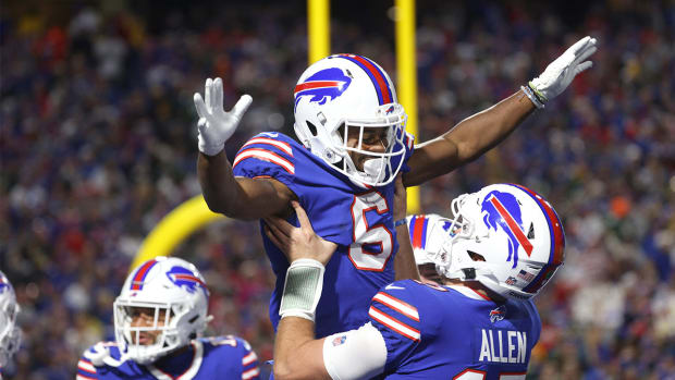 After scoring on a 7 yard touchdown run, Bills receiver Isaiah McKenzie celebrates with Josh Allen.