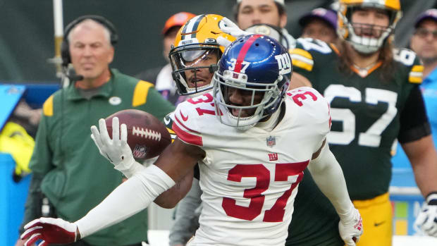 Oct 9, 2022; London, United Kingdom; New York Giants cornerback Fabian Moreau (37) defends against Green Bay Packers wide receiver Allen Lazard (13) in the second half during an NFL International Series game at Tottenham Hotspur Stadium.