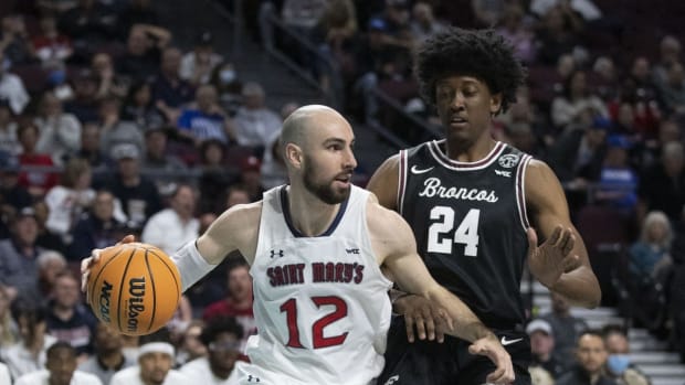 March 7, 2022; Las Vegas, NV, USA; Saint Mary's Gaels guard Tommy Kuhse (12) dribbles the basketball against Santa Clara Broncos guard Jalen Williams (24) during the first half in the semifinals of the WCC Basketball Championships at Orleans Arena. Mandatory Credit: Kyle Terada-USA TODAY Sports