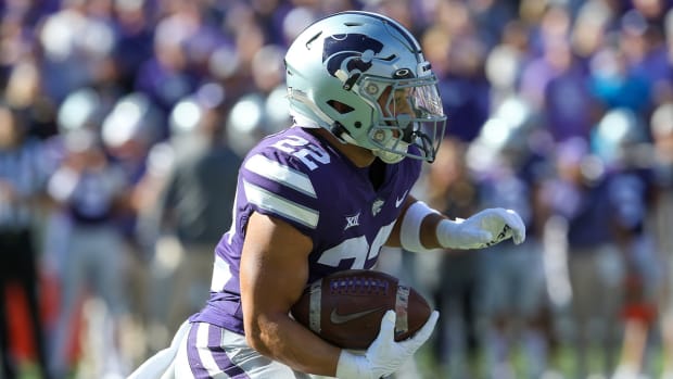 Oct 29, 2022; Manhattan, Kansas, USA; Kansas State Wildcats running back Deuce Vaughn (22) carries the ball during the first quarter against the Oklahoma State Cowboys at Bill Snyder Family Football Stadium.