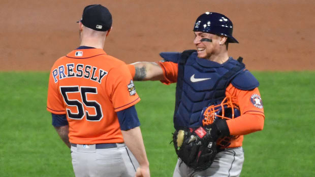 Astros pitcher Ryan Pressly celebrates with catcher Christian Vazquez after the final out of Game 4 of the 2022 World Series.