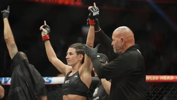 Mar 5, 2022; Las Vegas, Nevada, UNITED STATES; Marina Rodriguez (red gloves) celebrates after defeating Yan Xiaonan (not pictured) during UFC 272 at T-Mobile Arena.