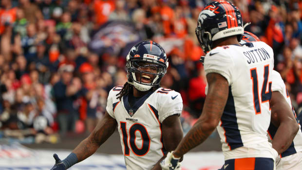 Denver Broncos wide receiver Jerry Jeudy (10) is congratulated by wide receiver Courtland Sutton (14) after scoring a touchdown against the Jacksonville Jaguars in the second quarter during an NFL International Series game at Wembley Stadium.