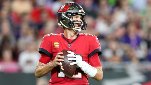 Buccaneers quarterback Tom Brady (12) drops back to pass during a game against the Ravens.