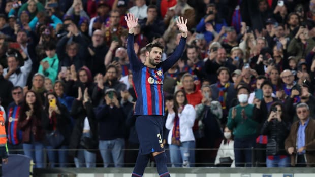 Gerard Pique pictured waving to Barcelona fans after being subbed off in the final game of his playing career
