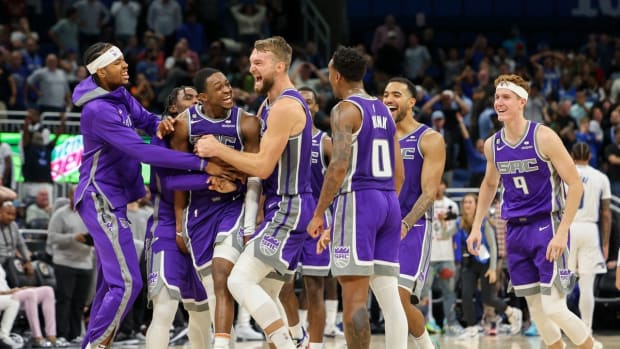 Nov 5, 2022; Orlando, Florida, USA; Sacramento Kings guard De'Aaron Fox (5) is congratulated after making a three pointer at the buzzer to beat the Orlando Magic in overtime at Amway Center. Mandatory Credit: Nathan Ray Seebeck-USA TODAY Sports