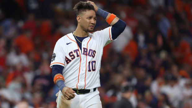 Astros first baseman Yuli Gurriel rubs his hands through his hair in between innings during a World Series game vs. the Philadelphia Phillies.